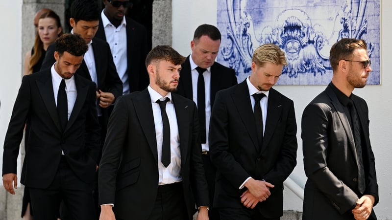Irish international Caoimhín Kelleher alongside Northern Irish international Conor Bradley at the funeral of Diogo Jota and André Silva in Portugal today