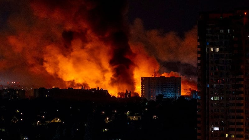 Flames and smoke billow from buildings during mass Russian drones and missile strikes on Ukraine's capital on 4 July