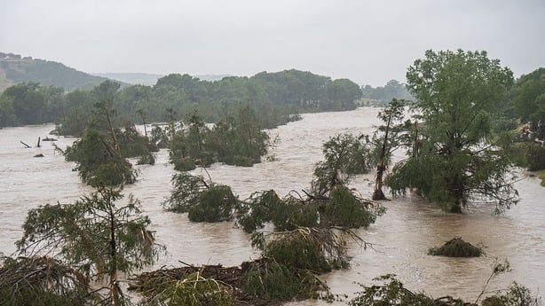 KERRVILLE, TEXAS - JULY 04: Trees emerge from flood waters along the Guadalupe River on July 4, 2025 in Kerrville, Texas. Heavy rainfall caused flooding along the Guadalupe River in central Texas with multiple fatalities reported. (Photo by Eric Vryn/Getty Images)