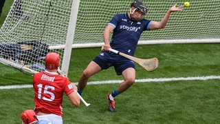 Brian Hayes of Cork shoots to score his side's first goal past Dublin goalkeeper Sean Brennan