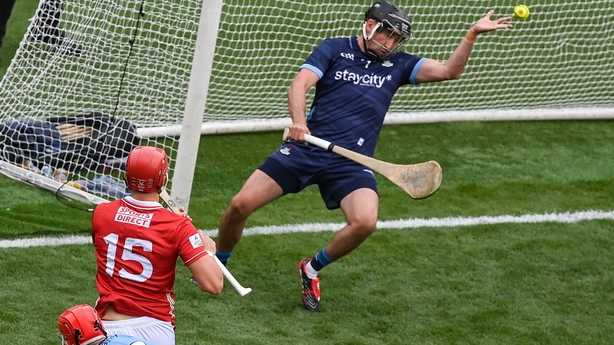 Brian Hayes of Cork shoots to score his side's first goal past Dublin goalkeeper Sean Brennan
