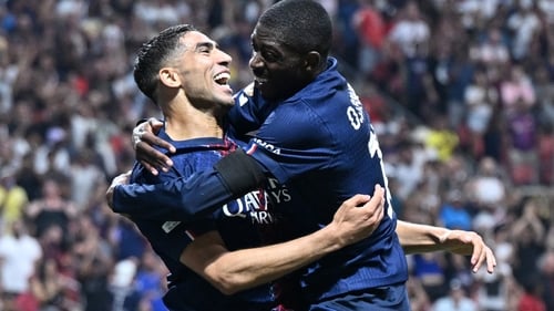 Achraf Hakimi celebrates with goalscorer Ousmane Dembele in PSG's win against Bayern Munich