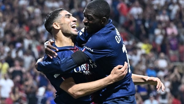 Achraf Hakimi celebrates with goalscorer Ousmane Dembele in PSG's win against Bayern Munich