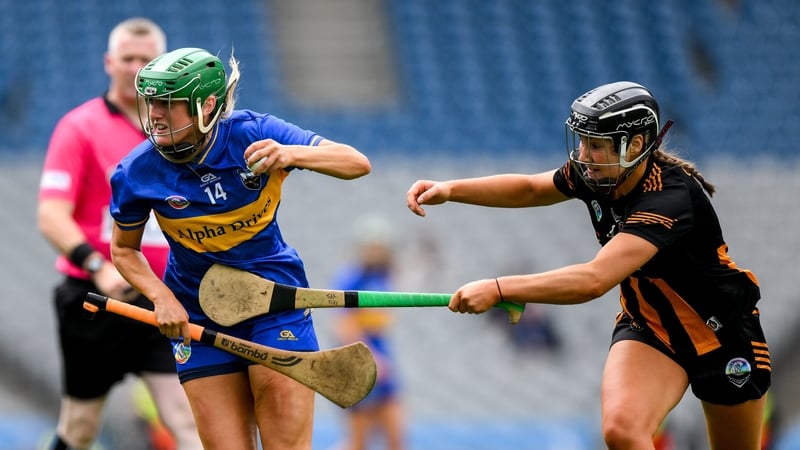 Casey Hennessy of Tipperary is tackled by Tiffanie Fitzgerald