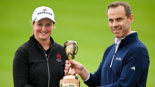 Lottie Woad of England is presented with the trophy by Managing Partner of KPMG Ryan McCarthy during day four of the 2025 KPMG Women’s Irish Open Golf Championship at Carton House Golf Club in Maynooth, Kildare.