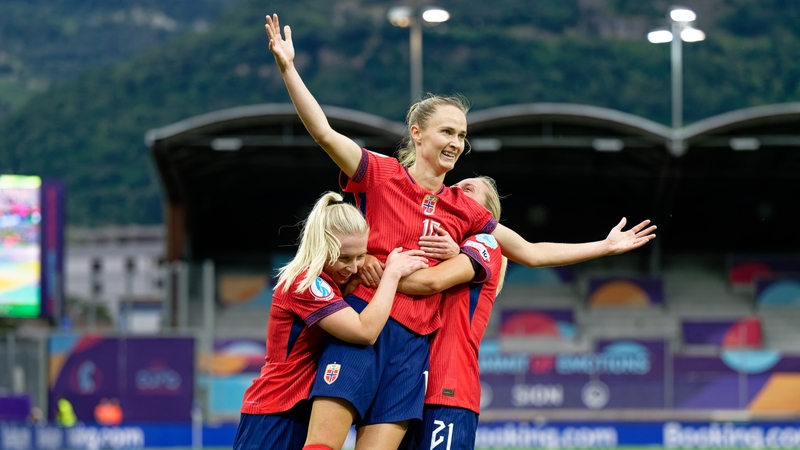 Caroline Graham Hansen is mobbed by her team-mates