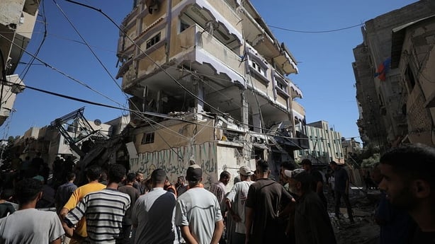 GAZA CITY, GAZA - JULY 06: Civil defense members and Palestinian residents inspect the site and conduct search and rescue operation amid rubble of buildings after Israeli army carried out an attack on a building in the Nuseirat Refugee Camp in Gaza City, Gaza on July 06, 2025. (Photo by Hassan Jedi/