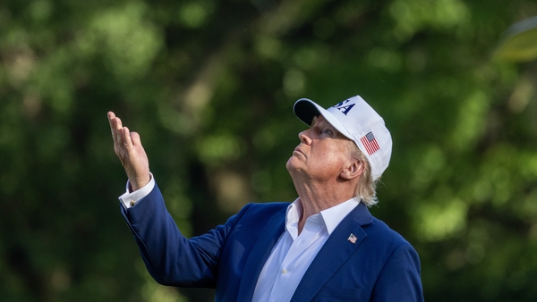 WASHINGTON, DC - JULY 06: U.S. President Donald Trump looks up at the new flag on the south lawn of the White House on July 06, 2025 in Washington, DC. President Trump is returning from a 4th of July weekend in Bedminster. (Photo by Tasos Katopodis/Getty