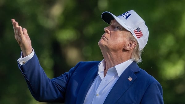 WASHINGTON, DC - JULY 06: U.S. President Donald Trump looks up at the new flag on the south lawn of the White House on July 06, 2025 in Washington, DC. President Trump is returning from a 4th of July weekend in Bedminster. (Photo by Tasos Katopodis/Getty
