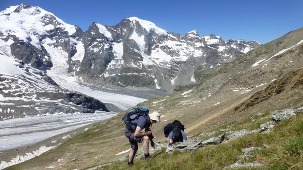 a group of people hiking in a mountain
