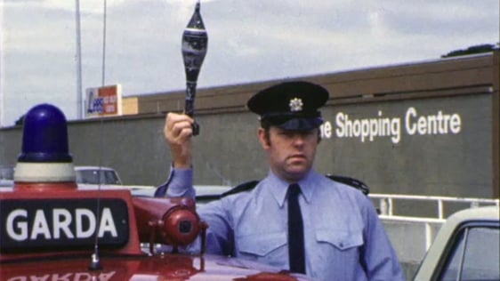 A garda displays a mortar bomb at the Northside Shopping Centre in Coolock, Dublin in 1975.