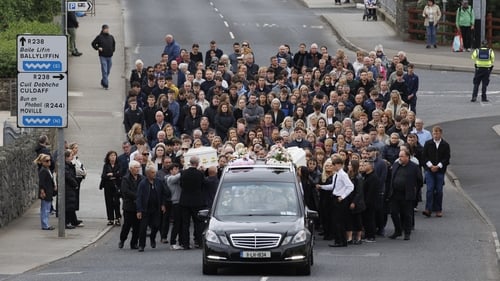 Two white coffins were carried from the home of Natalie McLaughlin's parents in Carndonagh town to the Sacred Heart Church