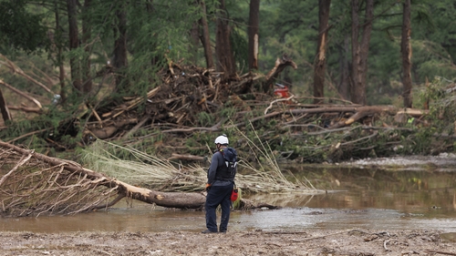 Search-and-rescue personnel continued their operation while facing the potential of more heavy rains