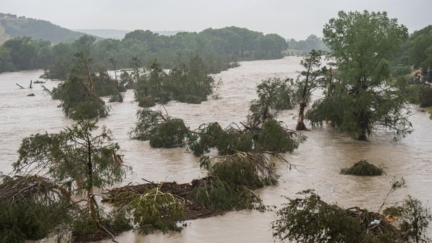 KERRVILLE, TEXAS - JULY 04: Trees emerge from flood waters along the Guadalupe River on July 4, 2025 in Kerrville, Texas. Heavy rainfall caused flooding along the Guadalupe River in central Texas with multiple fatalities reported. (Photo by Eric Vryn/Getty Images)