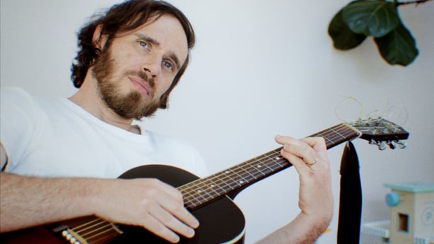 James Vincent McMorrow playing guitar