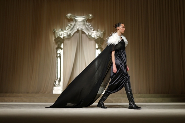 a person walking on a stage