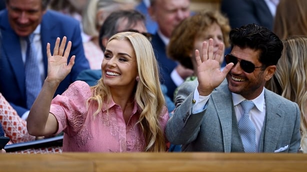 LONDON, ENGLAND - JULY 08: Singer, Katherine Jenkins and Andrew Levitas wave in the Royal Box prior to the Ladies' Singles quarter-final match between Aryna Sabalenka and Laura Siegemund of Germany on day nine of The Championships Wimbledon 2025 at All England Lawn Tennis and Croquet Club on July 08