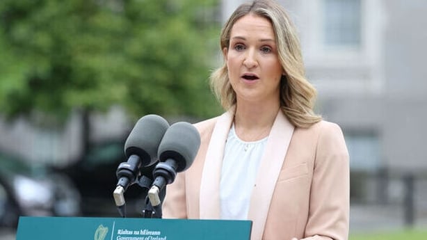 Minister for Education Helen McEntee announcing Commission of Investigationstanding at a podium with microphones