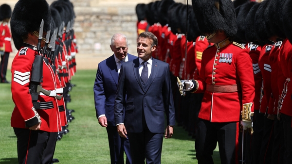 Britain's King Charles III and France's President Emmanuel Macron inspect the Guard of Honour during a ceremonial welcome at Windsor Castle, in Windsor west of London, on July 8, 2025, on the first day of a three-day state visit to Britain. French Preside