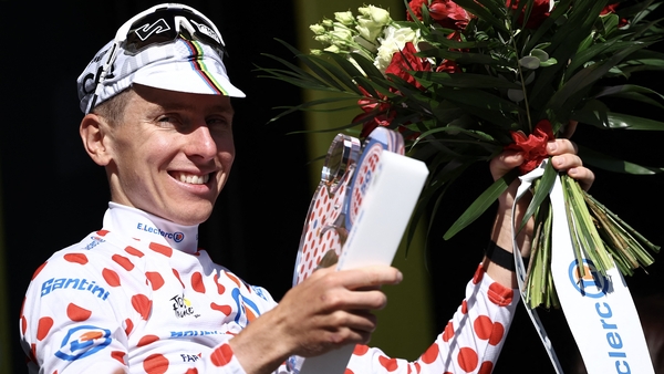 Slovenian rider Tadej Pogacar celebrates on the podium with the best climber's polka dot (dotted) jersey after the 4th stage of the 112th edition of the Tour de France cycling race, 174.2 km between Amiens Metropole and Rouen, Northern France, on July 8,