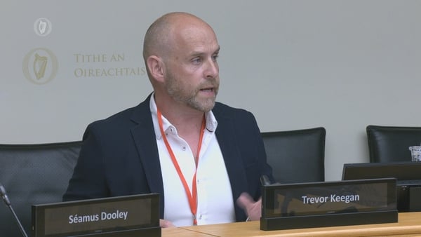 Co-Chair of the RTÉ Trade Union Group Trevor Keegan sitting before the Oireachtas media committee