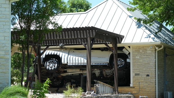 A car in a house after flood damage in Texas