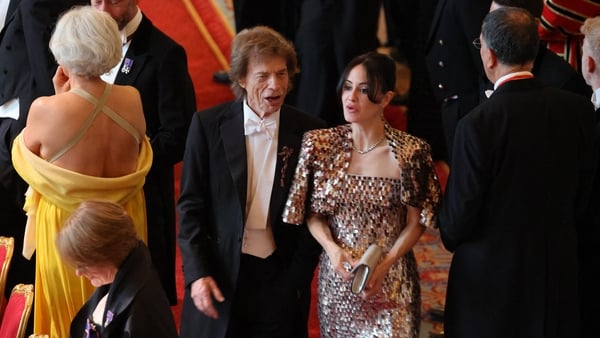 Mick Jagger of British rock band, The Rolling Stones (C-L) and his partner Melanie Hamrick attend a State Banquet at Windsor Castle, west of London, on July 8, 2025, on the first day of a three-day state visit of French President to Britain. French Presid