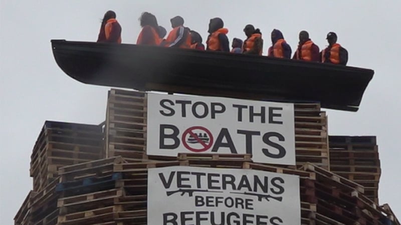 The boat containing more than a dozen life-sized mannequins wearing life jackets has been erected on top of the bonfire in Moygashel, Co Tyrone