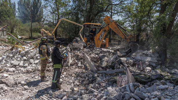 KOSTIANTYNIVKA, UKRAINE - JULY 09: Emergency workers continue their search for bodies in the rubble of a destroyed building after a Russian attack, which killed three people in Kostiantynivka, Ukraine on July 9, 2025. Firefighters also work on the scene to extinguish the fires caused by the Russian 