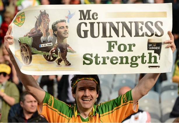 A Donegal supporter holds up a banner of Jim McGuinness at the end of the 2012 All-Ireland final