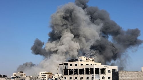 A plume of smoke rises during an Israeli strike in the Tuffah neighbourhood of Gaza