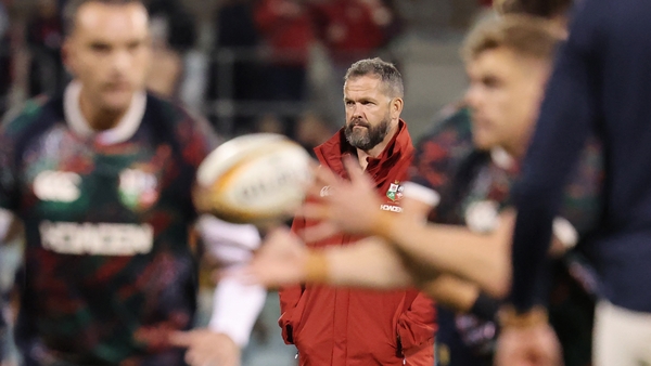 British and Irish Lions' head coach Andy Farrell (C) watches players warm up ahead of the rugby match between the British and Irish Lions and the ACT Brumbies in Canberra on July 9, 2025. (Pho