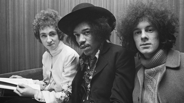 American guitarist and singer Jimi Hendrix (1942-1970) seated in centre with, on left, drummer Mitch Mitchell (1946-2008) and, on right, bassist Noel Redding (1945-2003) of the Jimi Hendrix Experience in London, circa August 1967