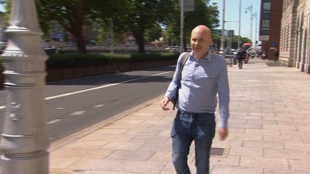 Paul Murphy walking outside the Four Courts in Dublin