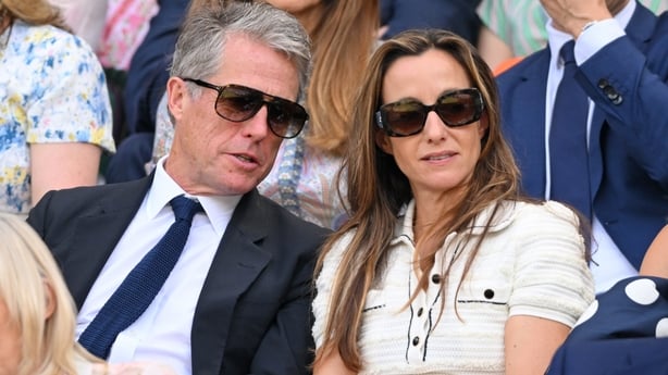 Hugh Grant and Anna Elisabet Eberstein attend day ten of the Wimbledon Tennis Championships at the All England Lawn Tennis and Croquet Club on July 09, 2025 in London