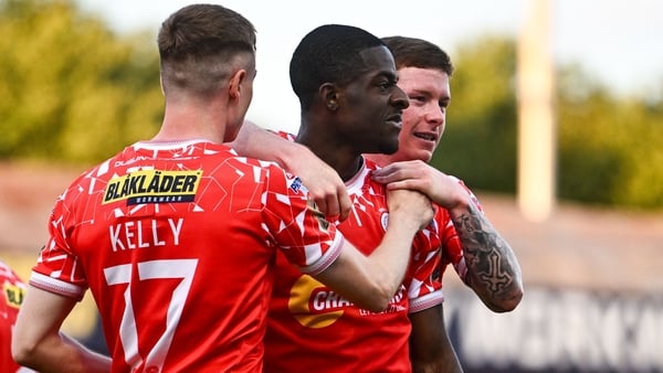 9 July 2025; Mipo Odubeko of Shelbourne, centre, celebrates with teammates Daniel Kelly, left, and Kameron Ledwidge after scoring their side's first goal during the UEFA Champions League First Qualifying Round first leg match between Shelbourne and Linfie