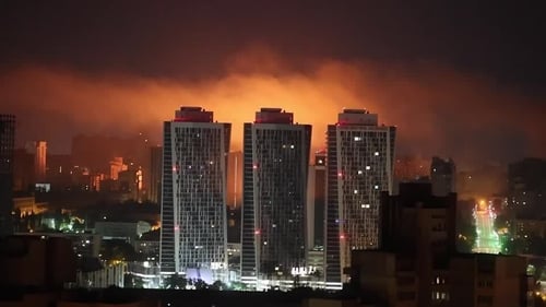 Russian attacks light up the Kyiv sky
