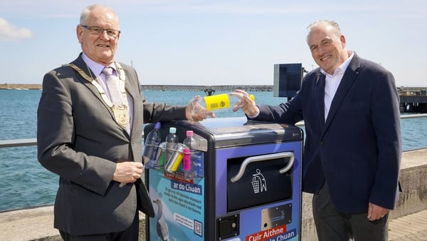 Jim Gildea and Ciaran Foley stand at a bin at the launch of a new Re-turn initiative in Dun Laoghaire