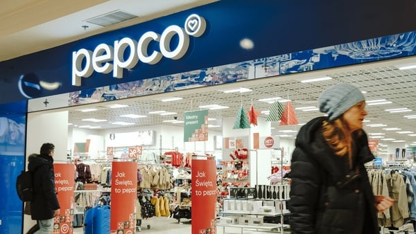 People walking outside a Pepco shop in Warsaw in Poland