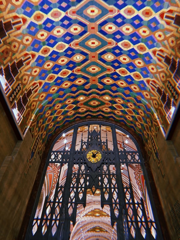 a ornate doorway with a colorful ceiling