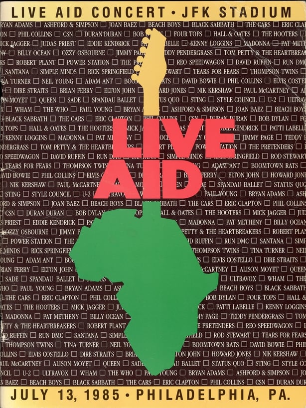Front cover of the program from the Live Aid concert at JFK Stadium in Philadelphia, Pennsylvania, July 13, 1985. The concert, and a simultaneous one at Wembley Stadium in London, England, were designed to raise awareness and funds for a worldwide hunger relief program. The cover features an outline