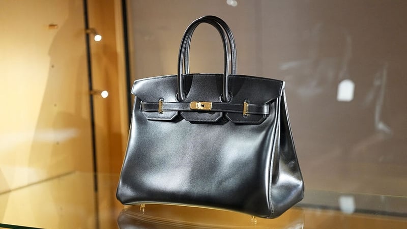 The black Hermès Birkin handbag in box calf leather with gold-tone hardware sold in Paris