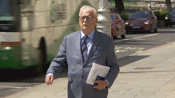 Former minister of state Finian McGrath walks outside the Four Courts after giving evidence in the case over legality of super junior ministers