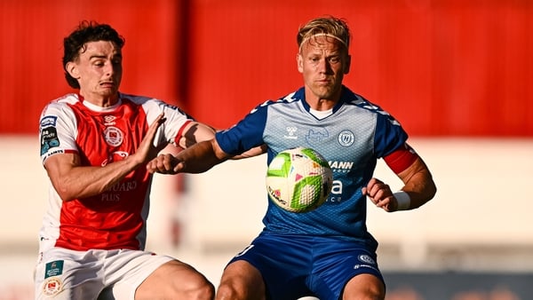 10 July 2025; Klaudijus Upstas of FC Hegelmann is tackled by Simon Power of St Patrick's Athletic during the UEFA Conference League First Qualifying Round first leg match between St Patrick's Athletic and FC Hegelmann at Richmond Park in Dublin. Photo by