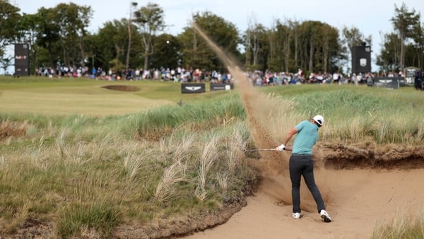Rory McIlroy of Northern Ireland plays from a bunker on day one of the Genesis Scottish Open