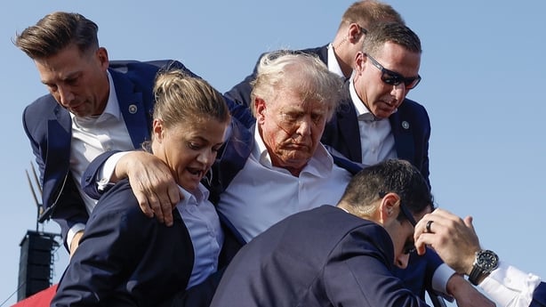 Donald Trump is rushed offstage by US Secret Service agents after being grazed by a bullet during a rally on 13 July 2024 in Butler, Pennsylvania