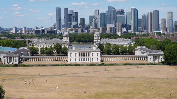 People sunbathe in Greenwich Park in London