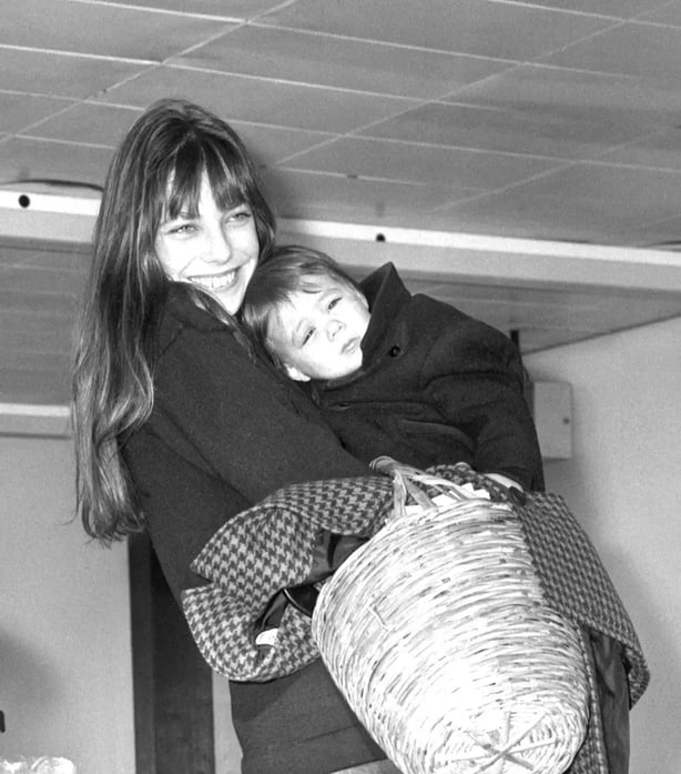 Jane Birkin carrying her baby and a wicker basket