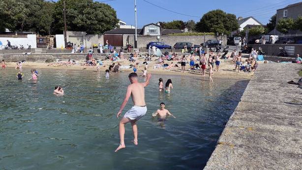 People swimming at Sandycove, Dublin during hot weather
