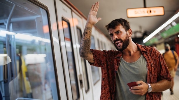 Young man mad after missing his subway train